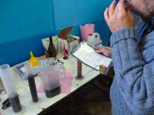 Hillel Manne taking maasrot from his wine at the Beit El Winery-small