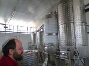 Yaacov Oryah and his Midbar Winery tanks-small