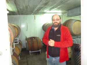 Yaacov Oryah in the barrel room o Midbar Winery-small