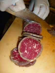 lovely frozen carpaccio being sliced thinly - look at that marbling