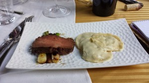 Course #8 60 day dry aged and Togarashi cured beef rib eye, corn raviloli, corn cream, smoked tomato and onion puree